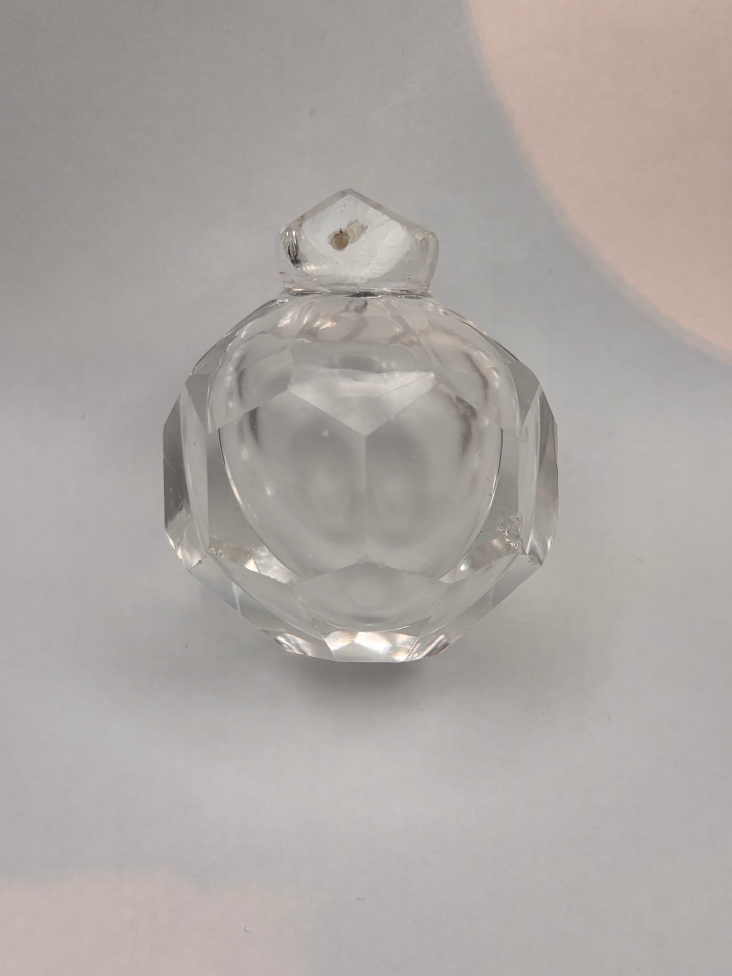 Finial with facets and opaline air bubble.