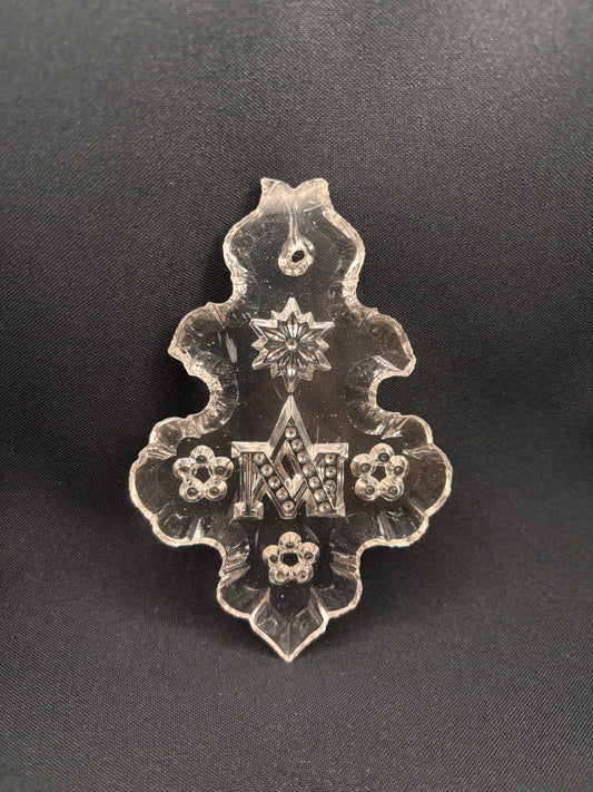 Plaquette with monogram MA, three flowers and a star